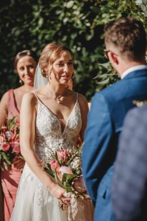 Burnham Grove Wedding - bride looks adoringly at her groom