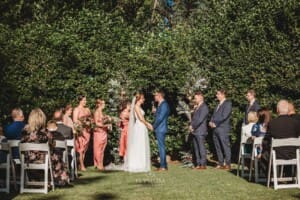 Burnham Grove Wedding - bride and groom hold hands during the ceremony