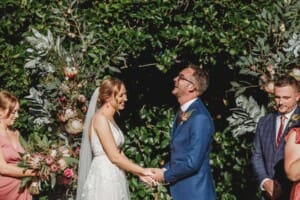 Burnham Grove Wedding - groom laughs as they are pronounced man and wife