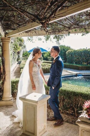 Burnham Grove Wedding - newlyweds hold hands after signing their marriage certificate