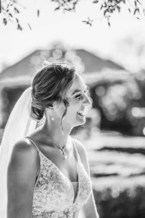 Burnham Grove Wedding - a bride smiles at her new husband