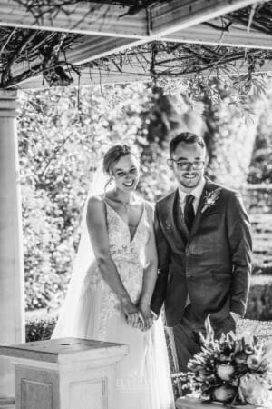 Burnham Grove Wedding - bride and groom hold hands after the ceremony