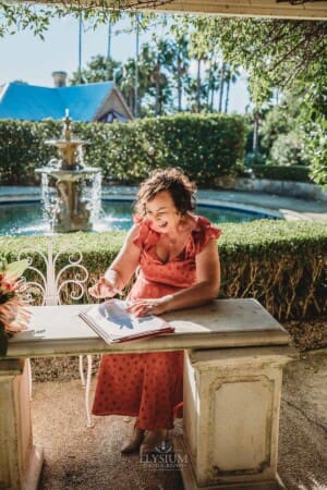 Burnham Grove Wedding - the celebrant signs the marriage certificate