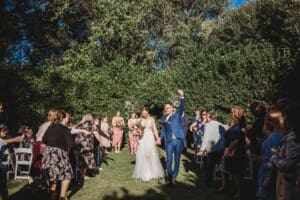 Burnham Grove Wedding - groom does a triumphant fist pump in the air