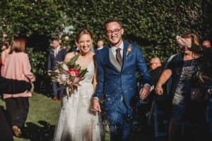 Burnham Grove Wedding - bride and groom walk down the aisle after the ceremony