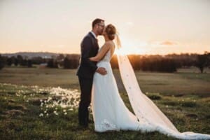 Burnham Grove Wedding - bride and groom kiss at sunset