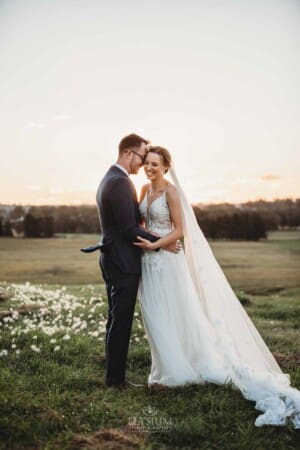 Burnham Grove Wedding - bride and groom hold each other close at sunset