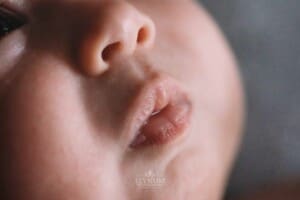 Newborn Photography - details showing baby lips in a tiny pout