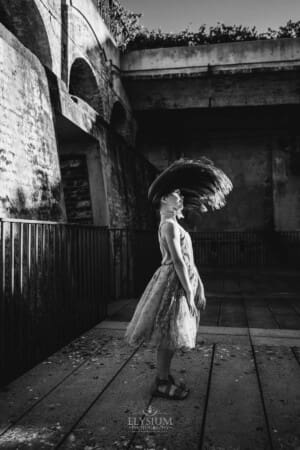 Paddington Gardens, a little girl flips her long hair