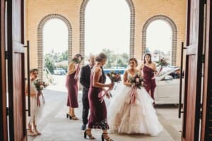 Gledswood Wedding - the bride exiting the car out the front of the church