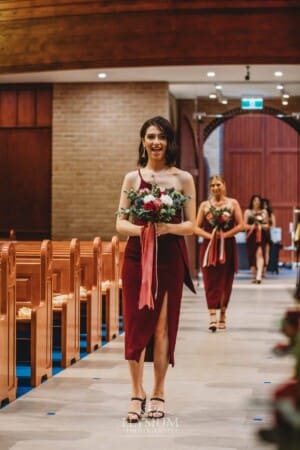 Gledswood Wedding - the bridesmaid walking down the aisle at the ceremony