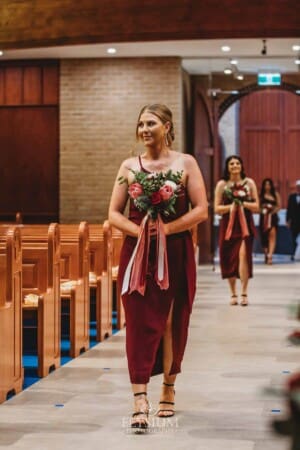 Gledswood Wedding - the bridesmaid walking down the aisle at the ceremony