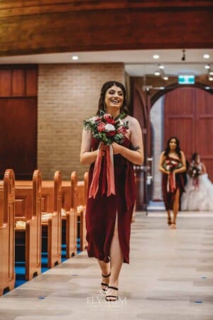 Gledswood Wedding - the bridesmaid walking down the aisle at the ceremony