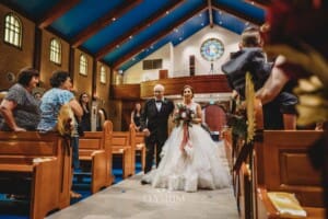 Gledswood Wedding - the bride and her father walking down the aisle at the ceremony
