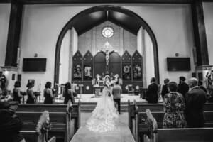 Gledswood Wedding - the bride and groom standing at the front of the church during the ceremony