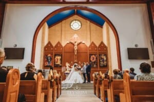 Gledswood Wedding - the bride and groom standing at the front of the church during the ceremony