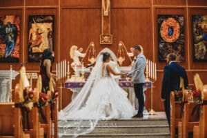 Gledswood Wedding - the bride and groom standing at the front of the church during the ceremony