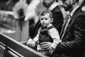 Gledswood Wedding - a little boy watches the wedding ceremony with his father
