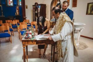 Gledswood Wedding - the witnesses sign the marriage certificate after the ceremony