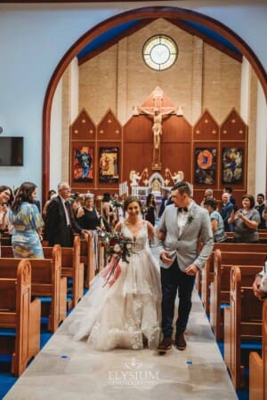 Gledswood Wedding - the bride and groom walk back down the aisle after the ceremony