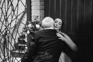 Gledswood Wedding - the bride hugs her dad after the ceremony