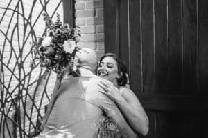 Gledswood Wedding - the bride hugs a wedding guest after the ceremony