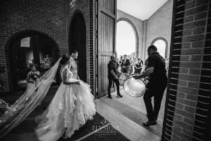 Gledswood Wedding - the bride and groom exit the church to Turkish drummers