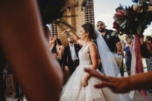 Gledswood Wedding - the bride and groom exit the church to Turkish drummers