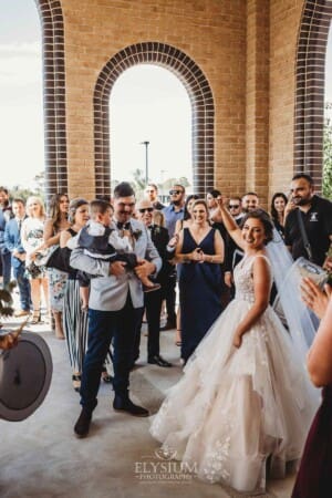 Gledswood Wedding - the bride and groom exit the church to Turkish drummers