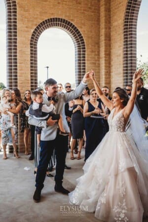 Gledswood Wedding - the bride and groom exit the church to Turkish drummers