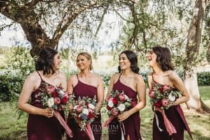 Gledswood Wedding - bridesmaids stand in the gardens at the venue