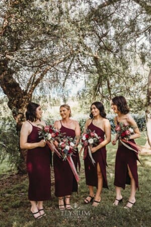 Gledswood Wedding - bridesmaids stand in the gardens at the venue