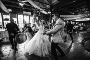 Gledswood Wedding - a bride and groom enter their reception to Turkish drummers