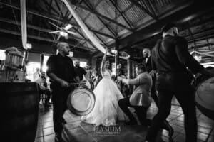 Gledswood Wedding - a bride and groom enter their reception to Turkish drummers