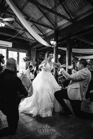 Gledswood Wedding - a bride and groom enter their reception to Turkish drummers