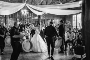Gledswood Wedding - a bride and groom enter their reception to Turkish drummers