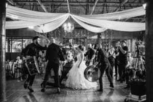 Gledswood Wedding - a bride and groom enter their reception to Turkish drummers