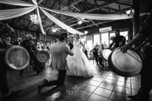 Gledswood Wedding - a bride and groom enter their reception to Turkish drummers
