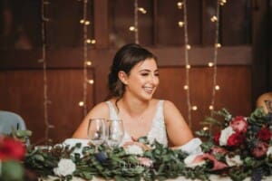 Gledswood Wedding - a bride laughs as her groom makes his speech