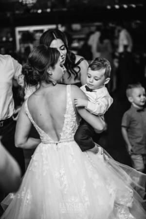 Gledswood Wedding - a bride dances with her little boy at the reception