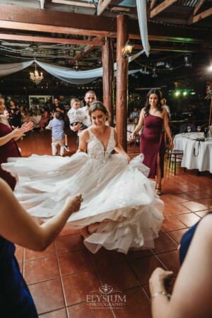 Gledswood Wedding - a bride dances with her guests at the reception