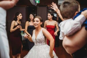 Gledswood Wedding - a bride dances with her guests at the reception