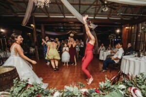 Gledswood Wedding - a wedding guest catches the brides bouquet