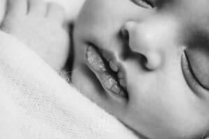 Details of a tiny newborn baby's lips and nose