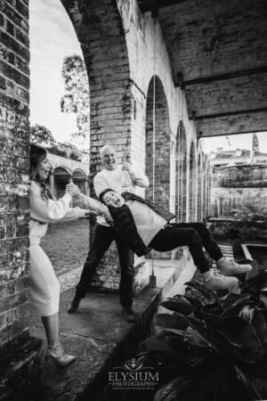 Family Photography: parents swinging their son between them at Paddington Reservoir Gardens