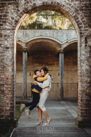 Family Photographer: a mother cuddles her son at Paddington Reservoir Gardens