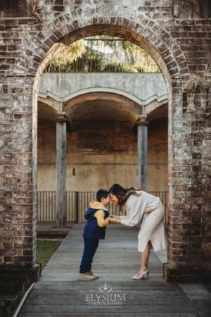 Family Photographer: a mother cuddles her son at Paddington Reservoir Gardens