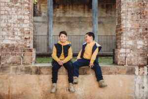 Sydney Family Photographer: brothers sit together on an old stone wall