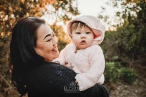 Family Photography: a mother cuddles her baby girl