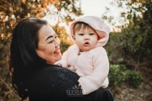 Family Photography: a mother cuddles her baby girl